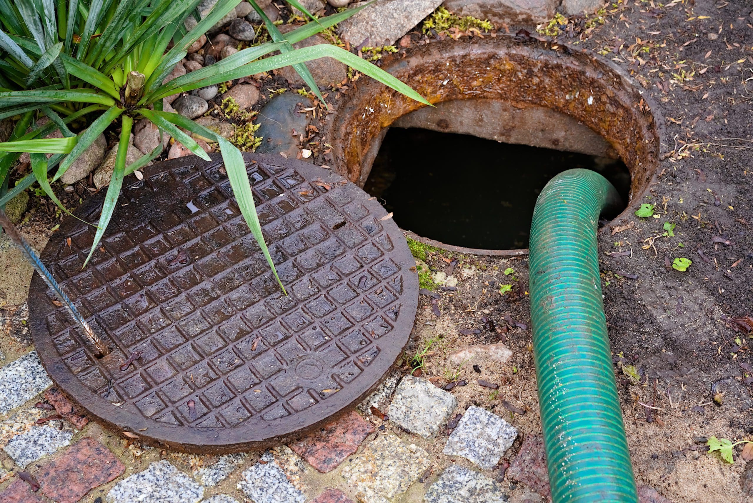 pumping septic tanks from the backyard tank in the countryside