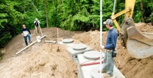 image of 3 workers installing a new septic system