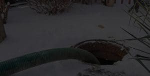 a septic tank being pumped out