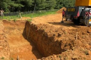 excavating the ground to install a septic tank