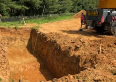 excavating the ground to install a septic tank