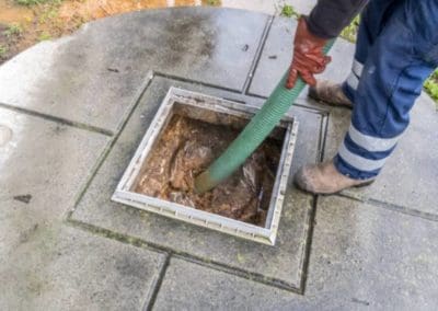 Technician performing a Septic tank cleaning