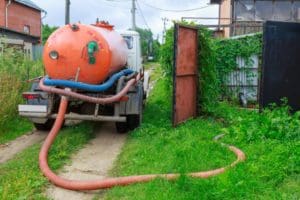 sewage tanker for cleaning the septic system in the process of pumping a septic tank