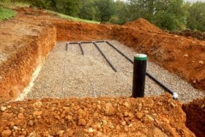 excavating and plumbing for a new septic tank installation