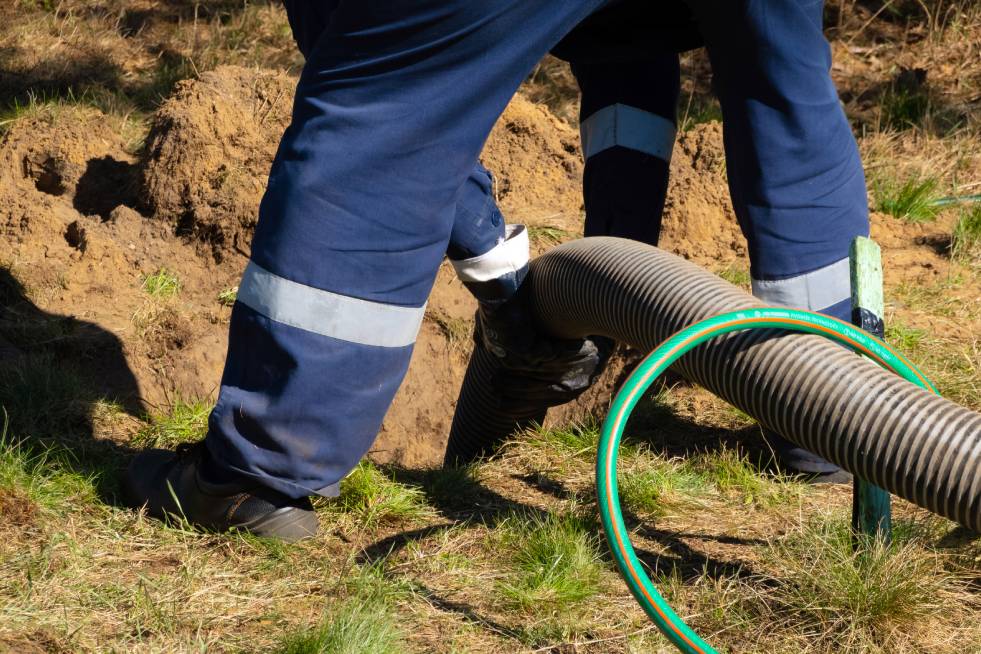 a person is cleaning the septic system