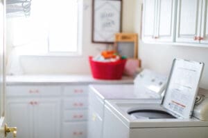 Top load washer in laundry room